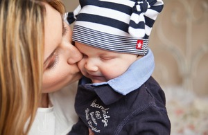 Mary gives a sweet kiss to her little Andy.